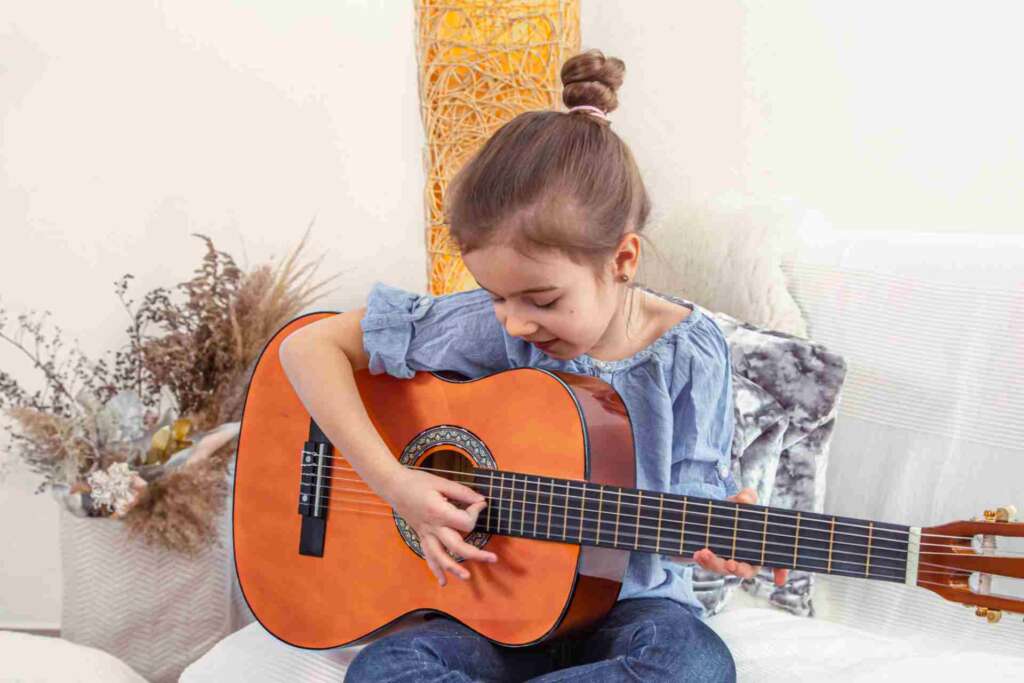 girl playing guitar